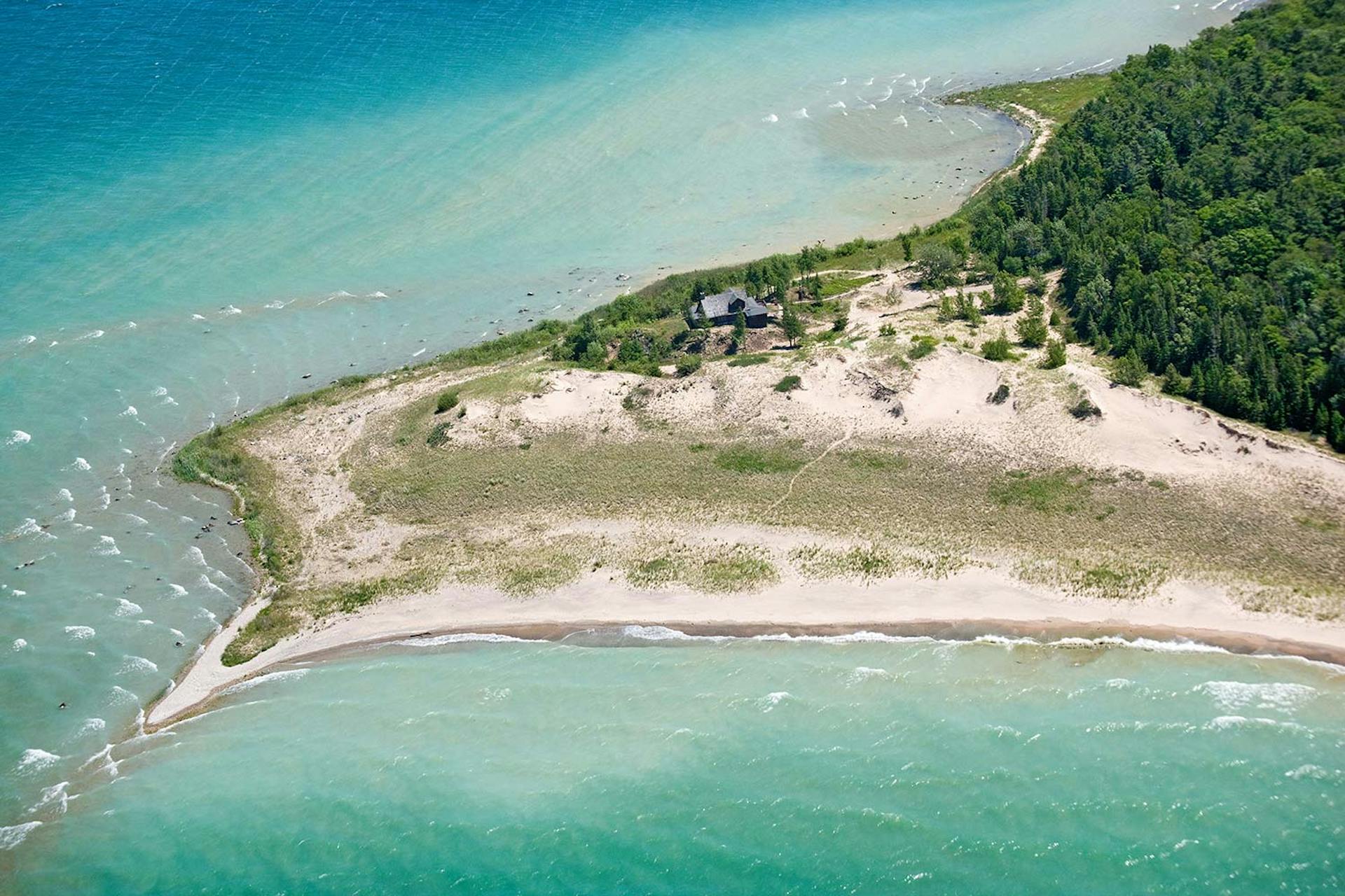Cathead Point | a case study of how earth asset’s due diligence enhances land-based wealth - this 100 acre conserved lake michigan estate owned by melissa’s family for 30+ years was sold by earth asset in under 1 year for a record-setting price to a conservation buyer   