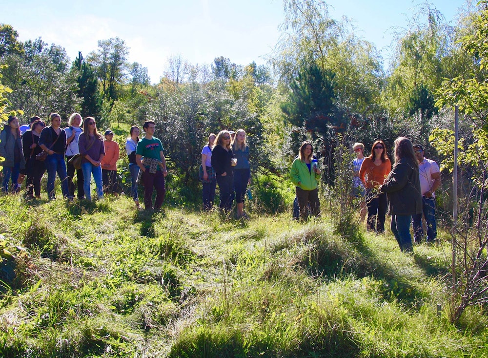 SHO Farm: vegan wild farming in a cold climate | melissa leading a tour of our 12 year old agroforestry system to screening attendees of the documentary plantpure nation, we hosted 2 screenings in 2016  