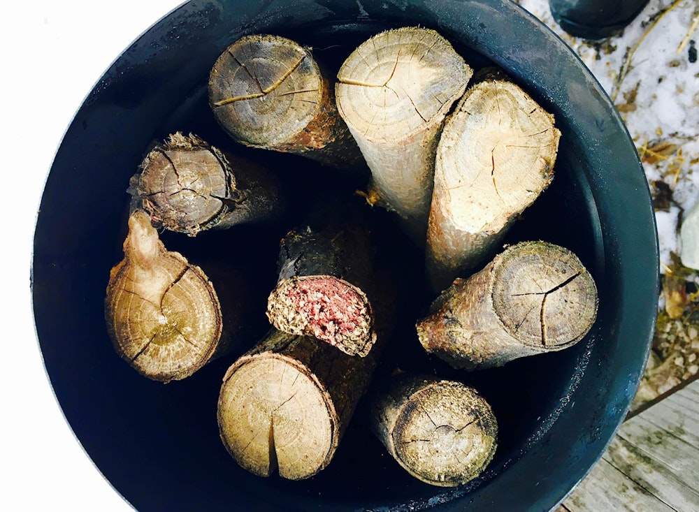 Food Lab at SHO: vegan gastronomy in a cold climate | custom-made, high-heat resistant metal container filled with hardwood logs headed to tarm-wood-fired boilers for conversion to wood charcoal