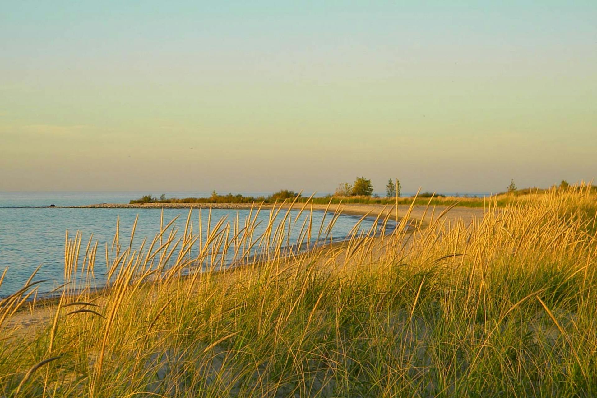 Cathead Point | a case study of how earth asset’s due diligence enhances land-based wealth - this 100 acre conserved lake michigan estate owned by melissa’s family for 30+ years was sold by earth asset in under 1 year for a record-setting price to a conservation buyer